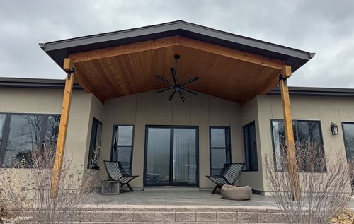 Covered outdoor patio with a timber ceiling
